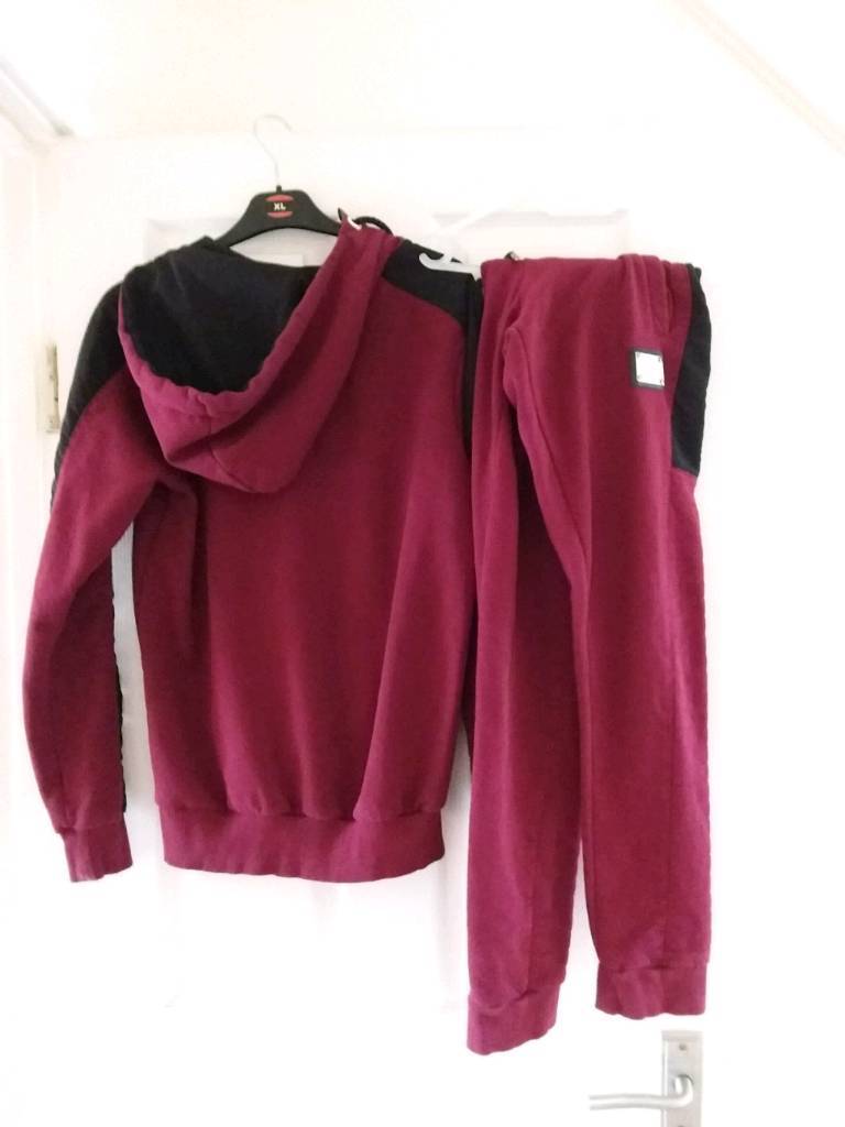 red supply and demand tracksuit